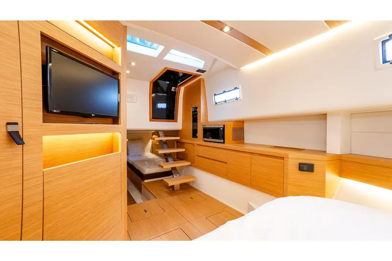 Slide: The Image of Luxurious interior of 2024 Pardo Yachts 43, featuring modern wood finishes and built-in amenities. - 44