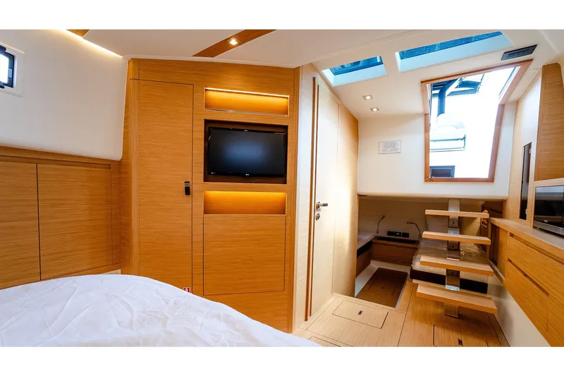 Slide: The Image of Luxurious interior of 2024 Pardo Yachts 43, featuring modern wood finishes and skylight. - 45