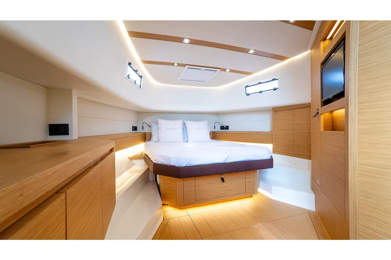 Slide: The Image of Luxurious cabin interior of 2024 Pardo Yachts 43, featuring modern wood finishes and ambient lighting. - 47
