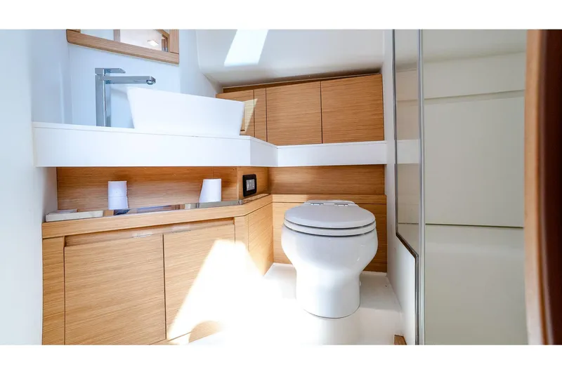Slide: The Image of Luxurious bathroom in 2024 Pardo Yachts 43, featuring modern fixtures and wooden cabinetry. - 52