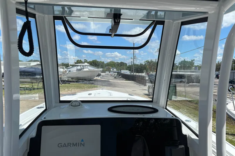 Slide: The Image of 2021 Sea Hunt Ultra 265 SE boat interior with Garmin navigation system. - 15