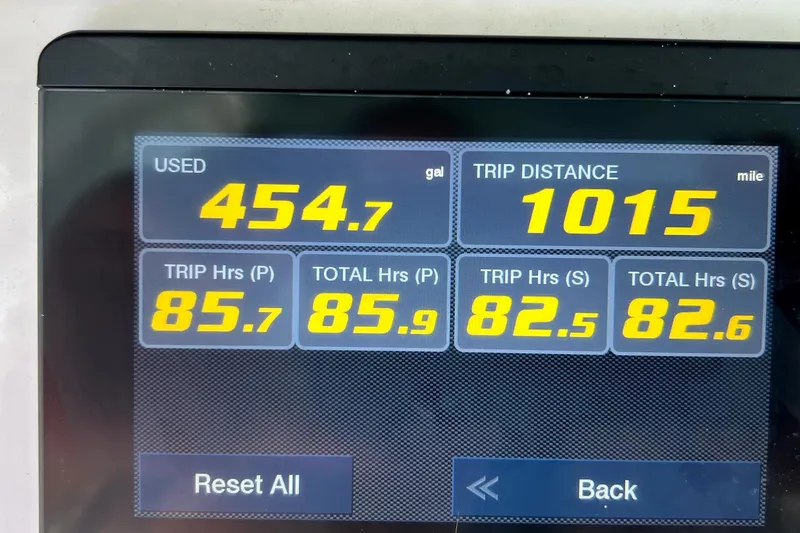 Slide: The Image of Display screen showing fuel usage and trip data for Sea Hunt Ultra 265 SE, 2021 model. - 8