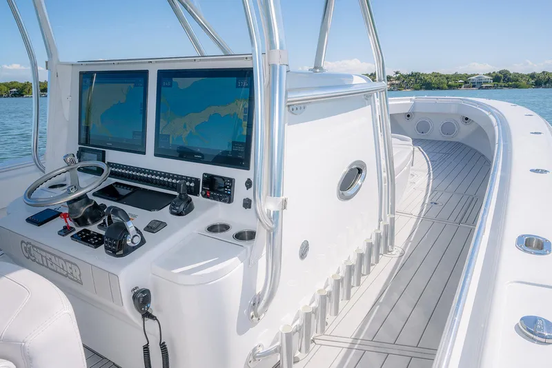 Slide: The Image of 2020 Contender 44ST boat cockpit with dual navigation screens and sleek design. - 20