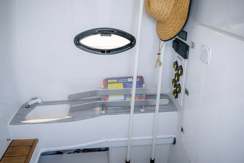 Slide: The Image of Interior of 2020 Contender 44ST boat with storage and control panel. - 24