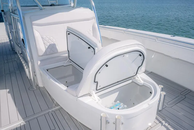 Slide: The Image of Contender 44ST 2020 boat with open storage compartments on deck. - 27