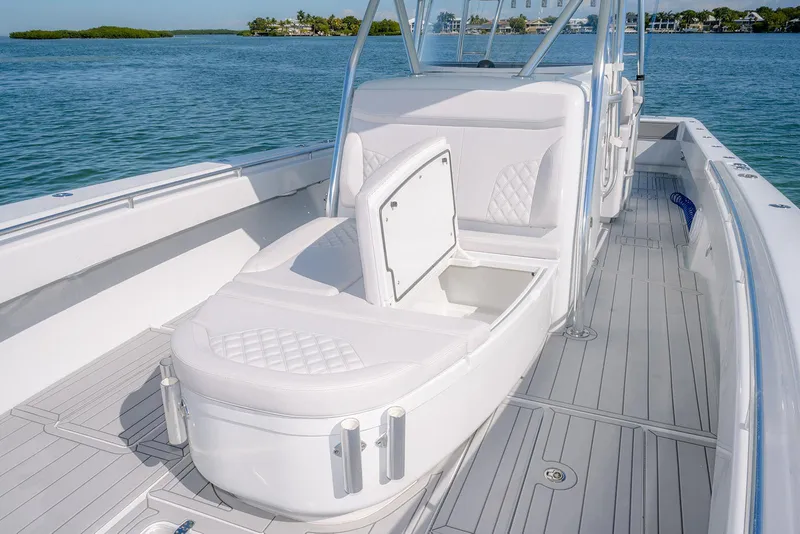 Slide: The Image of 2020 Contender 44ST boat with step hull, featuring sleek seating and open storage. - 28