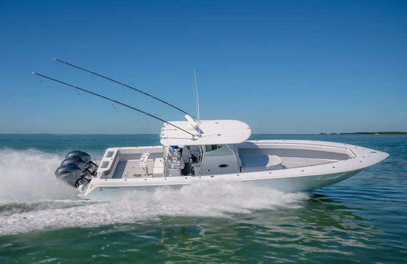 Slide: The Image of 2020 Contender 44ST boat speeding on water with fishing rods and triple engines. - 4