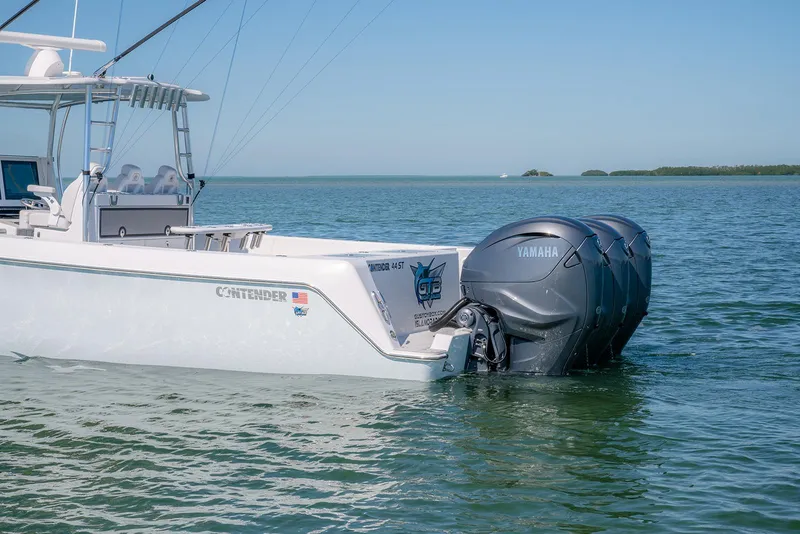 Slide: The Image of 2020 Contender 44ST boat with Yamaha engines on calm water. - 7