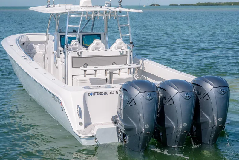 Slide: The Image of 2020 Contender 44ST boat with triple Yamaha outboard engines on calm water. - 8