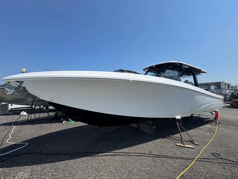 The Image of 2025 Fountain 43 SCX boat on display, sleek white design under clear blue sky. - 0