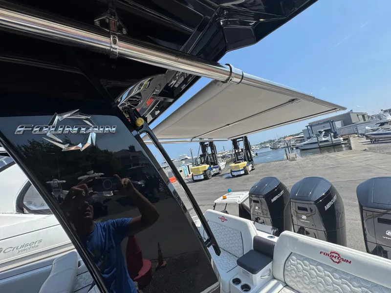 Slide: The Image of 2025 Fountain 43 SCX boat with Mercury engines at a marina dock. - 12