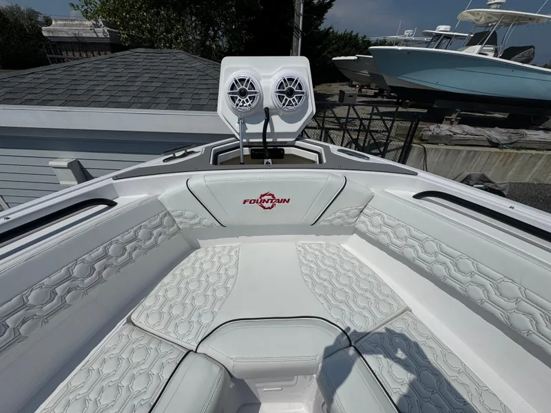 Slide: The Image of 2025 Fountain 43 SCX boat interior with white seating and speaker system. - 16