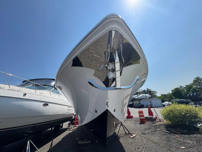 Slide: The Image of 2025 Fountain 43 SCX boat on dry dock under clear blue sky. - 20