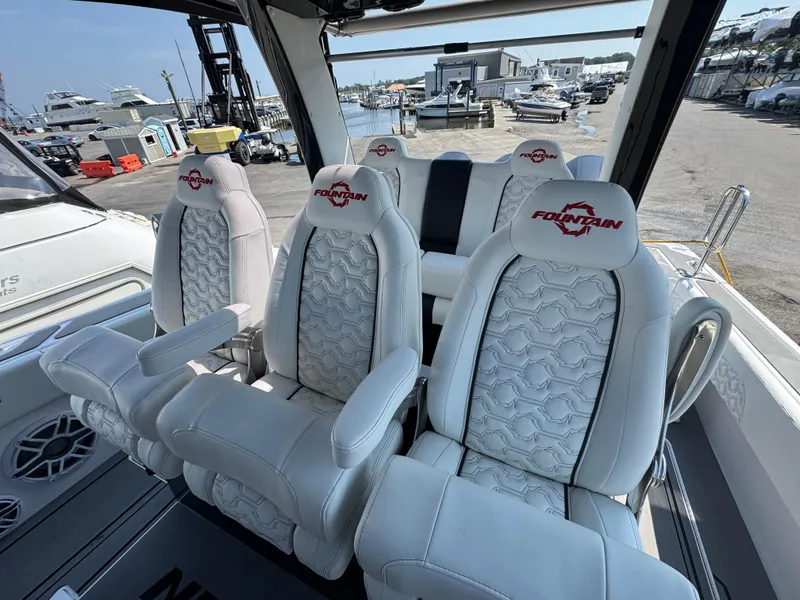 Slide: The Image of Luxury seating on 2025 Fountain 43 SCX boat, featuring stylish white upholstery and logo embroidery. - 9