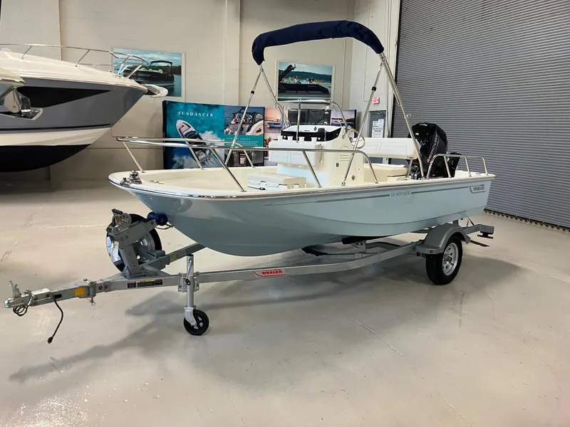 The Image of 2026 Boston Whaler 150 Montauk boat on trailer in showroom. - 0