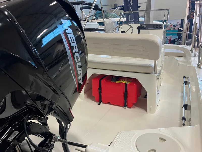 Slide: The Image of 2026 Boston Whaler 150 Montauk boat interior with Mercury engine and seating. - 5