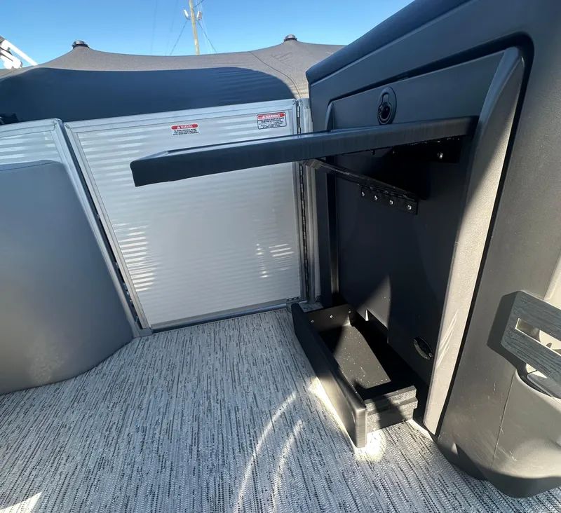 Slide: The Image of Interior of 2025 Bennington 24 MFB boat with modern seating and flooring. - 12