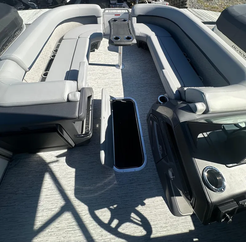 Slide: The Image of 2025 Bennington 24 MFB pontoon boat interior with spacious seating and storage compartments. - 13