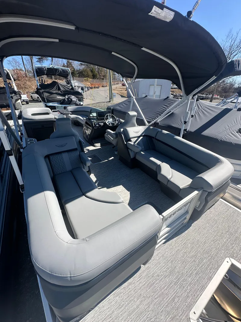Slide: The Image of 2025 Bennington 24 MFB pontoon boat interior with gray seating and canopy. - 6