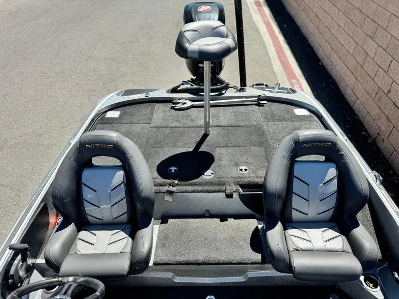 Slide: The Image of 2017 Tracker Nitro Z19 boat interior with two seats and a fishing chair. - 17