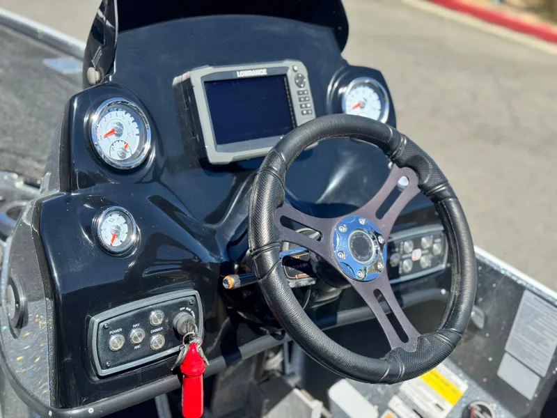 Slide: The Image of Steering console of 2017 Tracker Nitro Z19 boat with gauges and navigation system. - 25