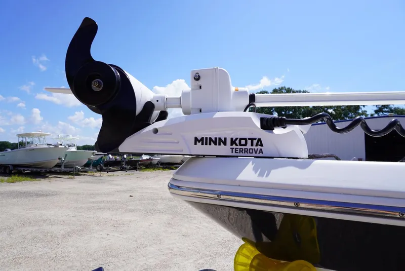 Slide: The Image of Minn Kota Terrova trolling motor on 2014 NauticStar 244 XTS boat under clear blue sky. - 13