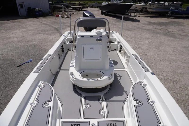 Slide: The Image of 2014 NauticStar 244 XTS boat interior with center console and spacious deck. - 2
