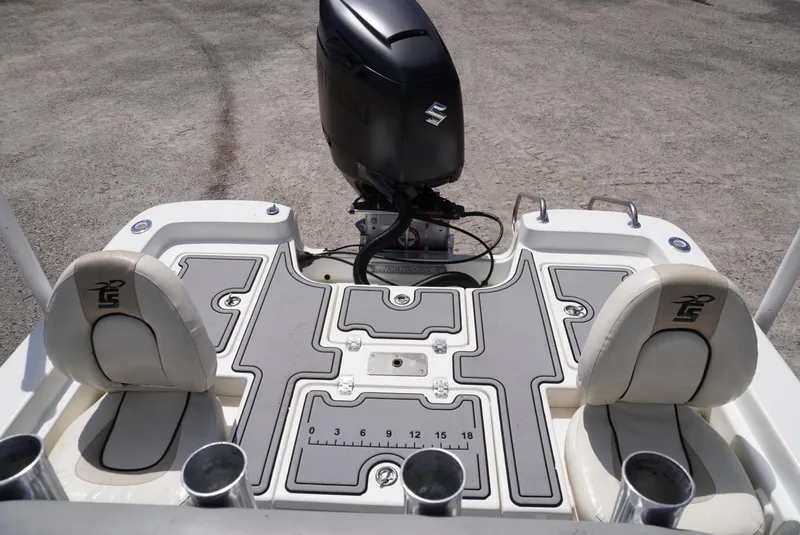Slide: The Image of 2014 NauticStar 244 XTS boat deck with seating and outboard motor. - 6