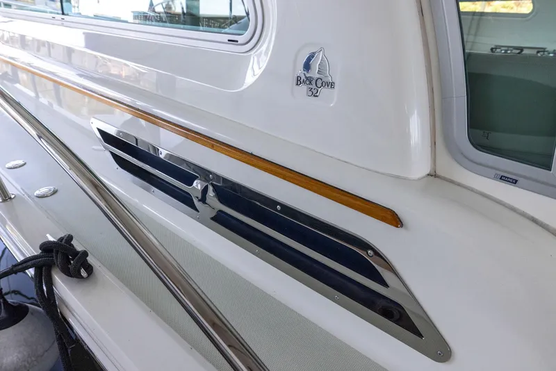 Slide: The Image of 2018 Back Cove 32 boat exterior with sleek design and polished details. - 11