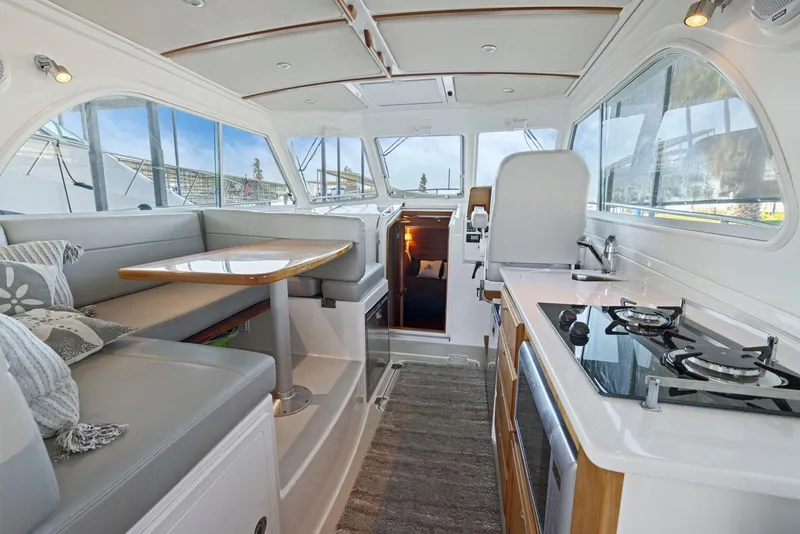 Slide: The Image of Interior of 2018 Back Cove 32 yacht with modern kitchen and dining area. - 42