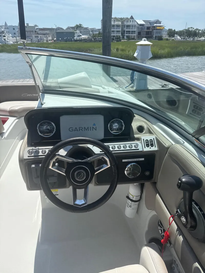 Slide: The Image of 2023 Crownline Eclipse E235 XS boat dashboard with Garmin navigation system. - 11