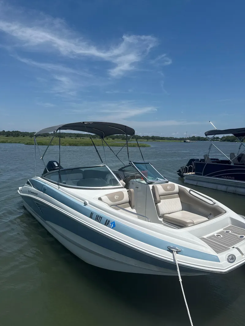 Slide: The Image of 2023 Crownline Eclipse E235 XS boat docked on a sunny day. - 5