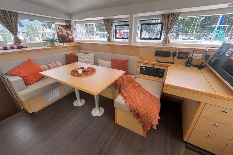 Slide: The Image of Interior of 2016 Lagoon 400 S2 catamaran with cozy seating and navigation station. - 1