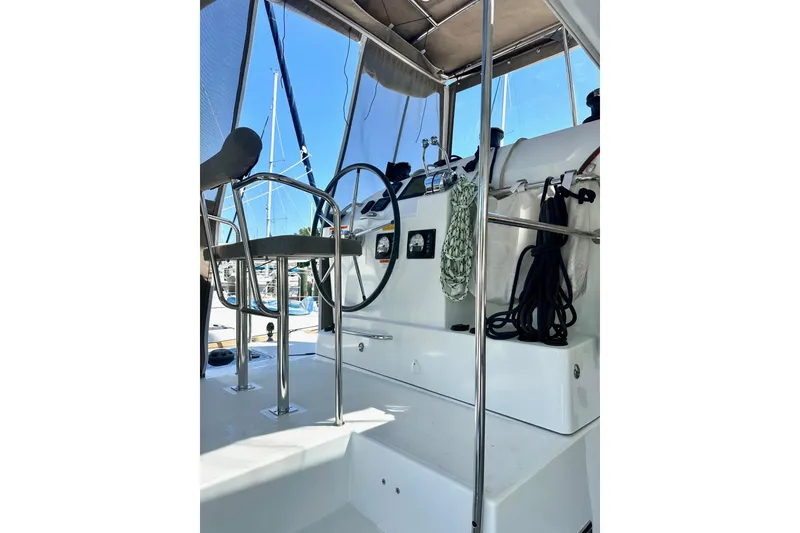 Slide: The Image of 2016 Lagoon 400 S2 yacht helm with ropes and steering wheel. - 14