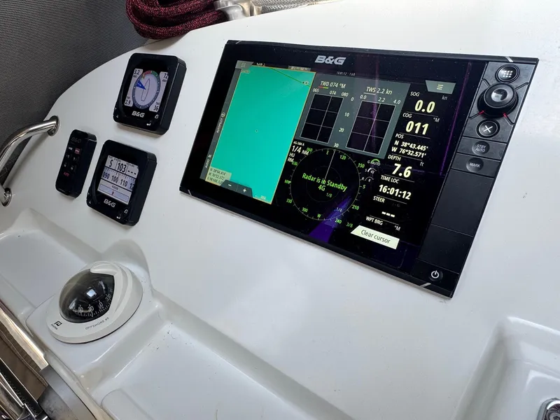 Slide: The Image of Navigation instruments on a 2016 Lagoon 400 S2 yacht dashboard. - 15