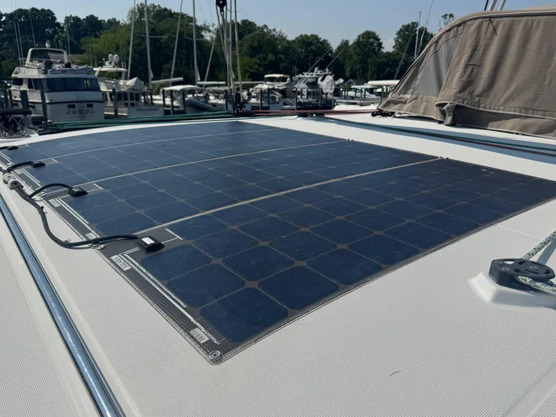 Slide: The Image of Solar panels on a 2016 Lagoon 400 S2 catamaran, docked at a marina. - 20