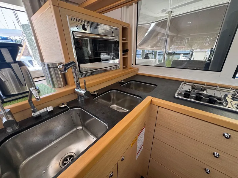 Slide: The Image of Modern kitchen in 2016 Lagoon 400 S2 yacht with dual sinks and stove. - 29