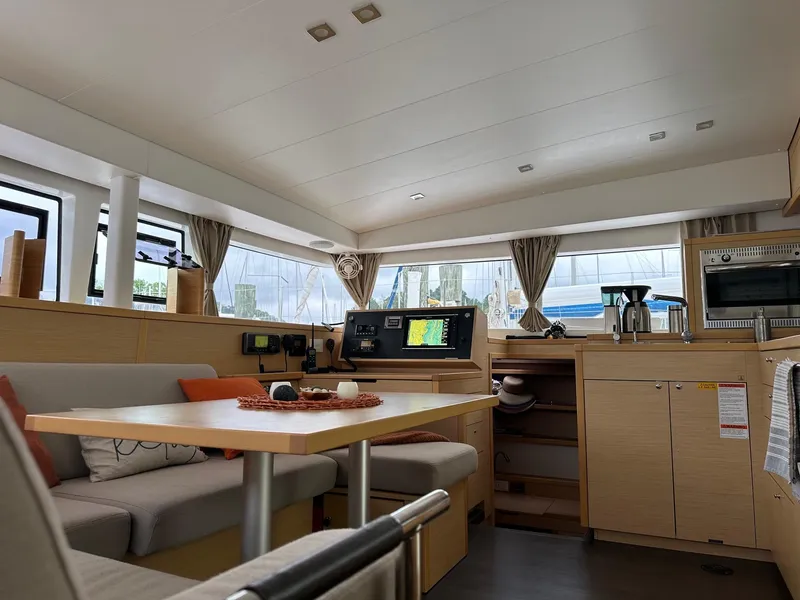 Slide: The Image of Interior of 2016 Lagoon 400 S2 catamaran, featuring modern kitchen and cozy seating area. - 34