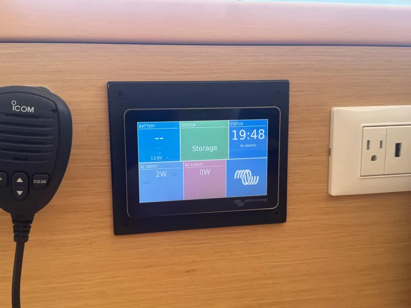 Slide: The Image of Control panel on a 2016 Lagoon 400 S2 yacht, displaying battery and system status. - 41