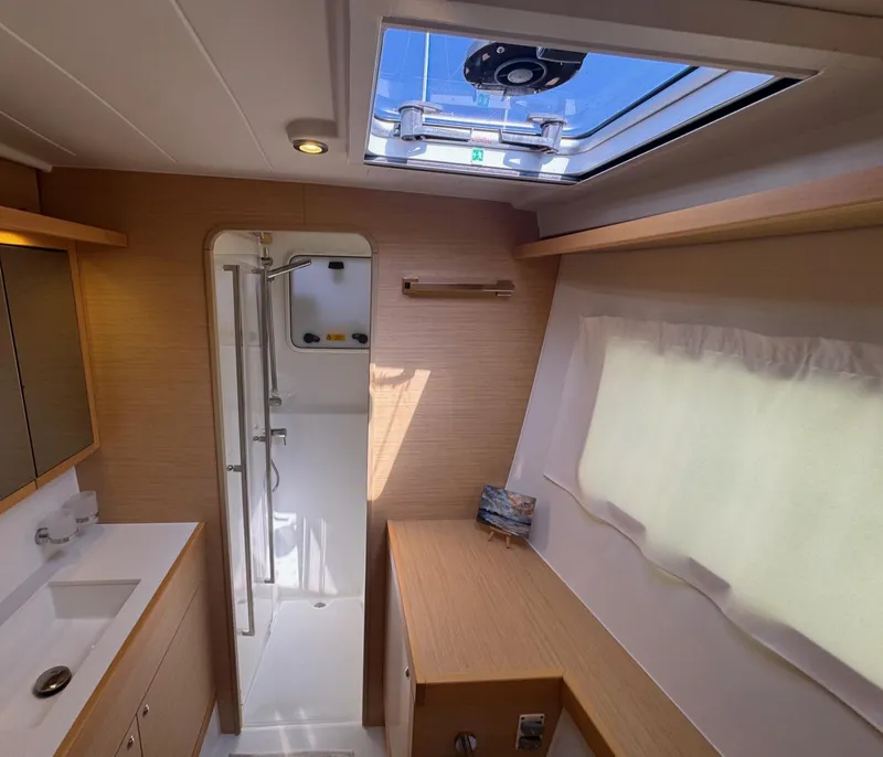 Slide: The Image of Interior of 2016 Lagoon 400 S2 yacht bathroom with shower and skylight. - 46