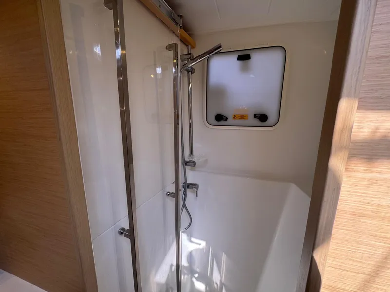 Slide: The Image of Shower area in 2016 Lagoon 400 S2 yacht, featuring modern fixtures and natural lighting. - 49
