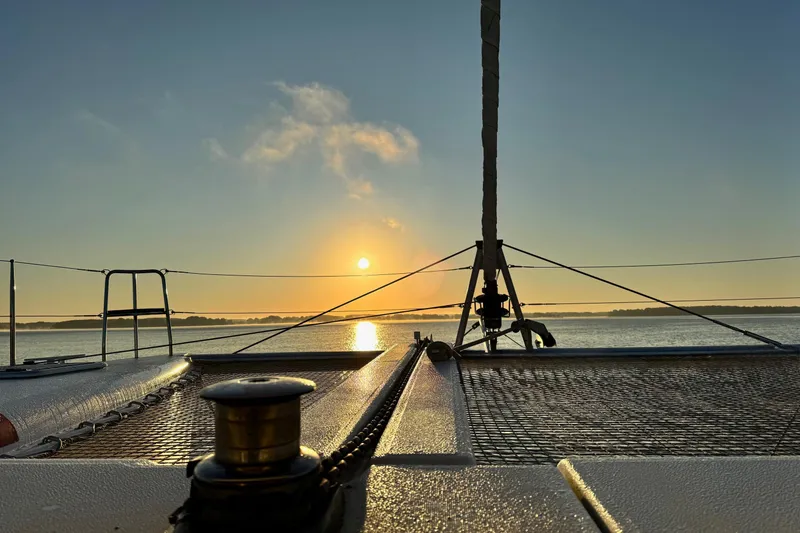 Slide: The Image of Sunset view from 2016 Lagoon 400 S2 catamaran deck, calm waters, serene atmosphere. - 76
