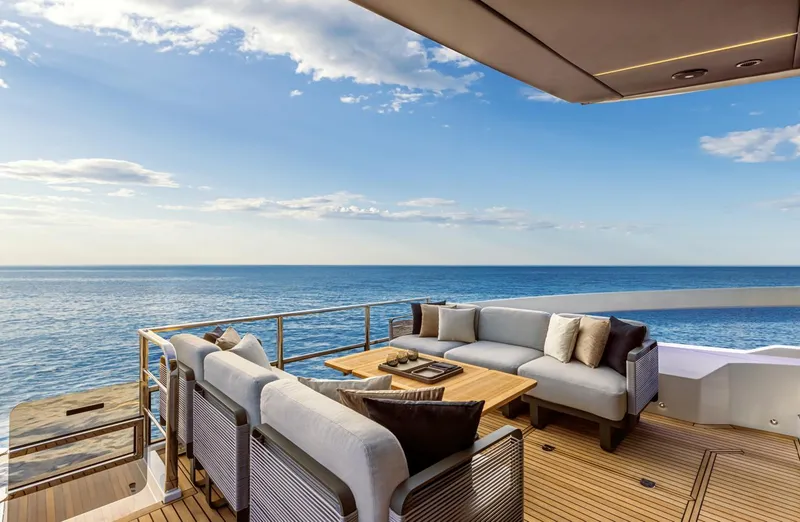 Slide: The Image of Luxurious deck of the 2024 Absolute 48 Coupe yacht with ocean view. - 6