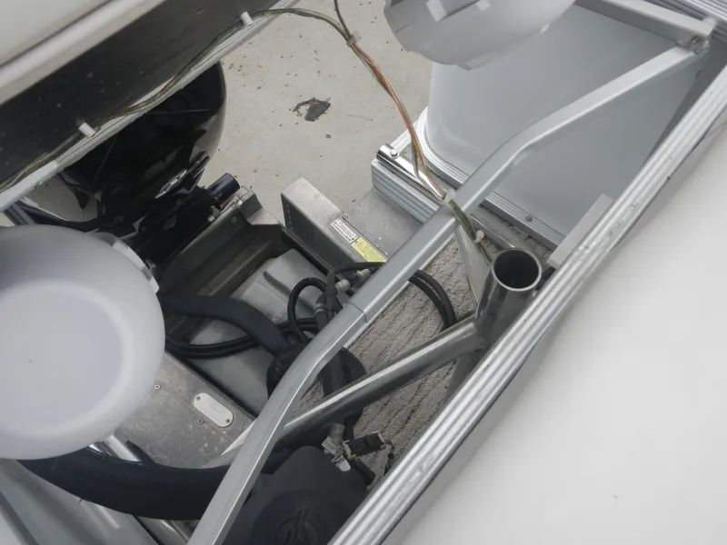 Slide: The Image of Engine compartment of a 2010 Crest Crest III boat, showing mechanical components and wiring. - 11