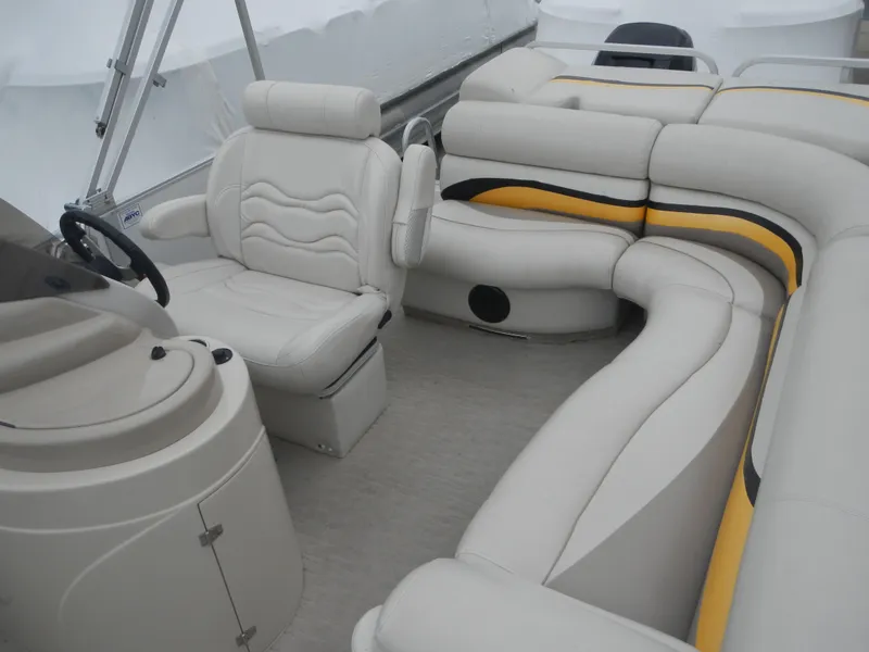 Slide: The Image of Luxurious 2010 Crest III boat interior with plush seating and modern steering console. - 15