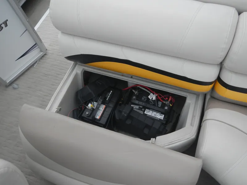 Slide: The Image of Crest III 2010 boat seat storage with batteries, showcasing efficient space utilization. - 21