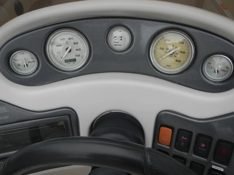 Slide: The Image of Dashboard of a 2010 Crest III boat with gauges and controls. - 8