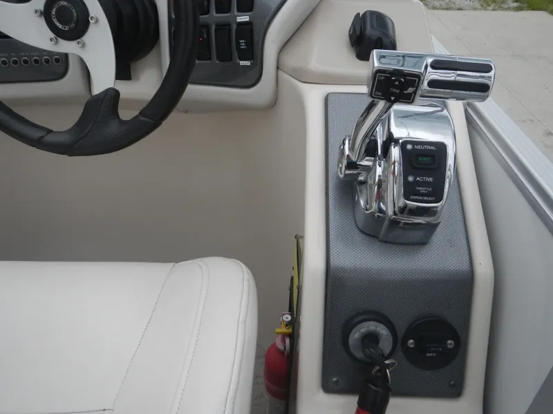Slide: The Image of Crest III 2010 boat control panel with steering wheel and throttle lever. - 9