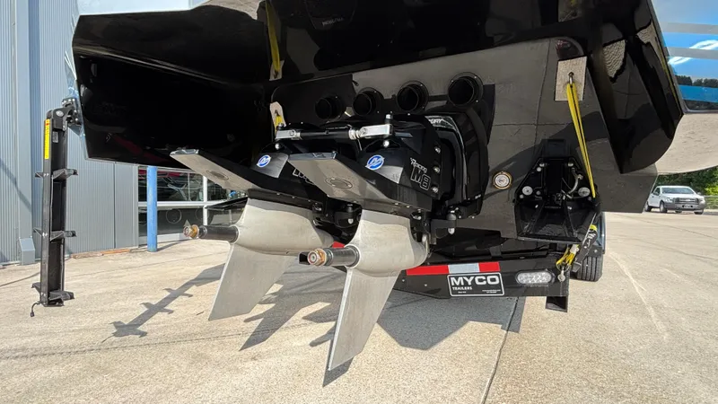 Slide: The Image of Rear view of 2025 Outerlimits 50 SL Crypto II boat with dual propellers. - 12