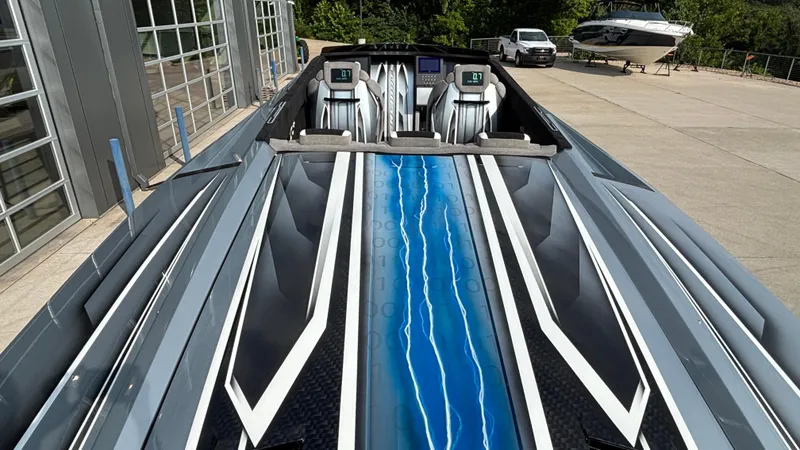 Slide: The Image of 2025 Outerlimits 50 SL Crypto II speedboat with sleek design and modern cockpit. - 15